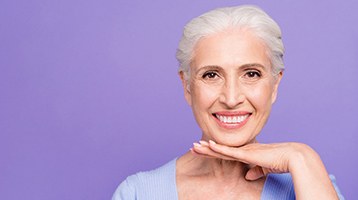 An older woman with dental implants in Longmont smiling